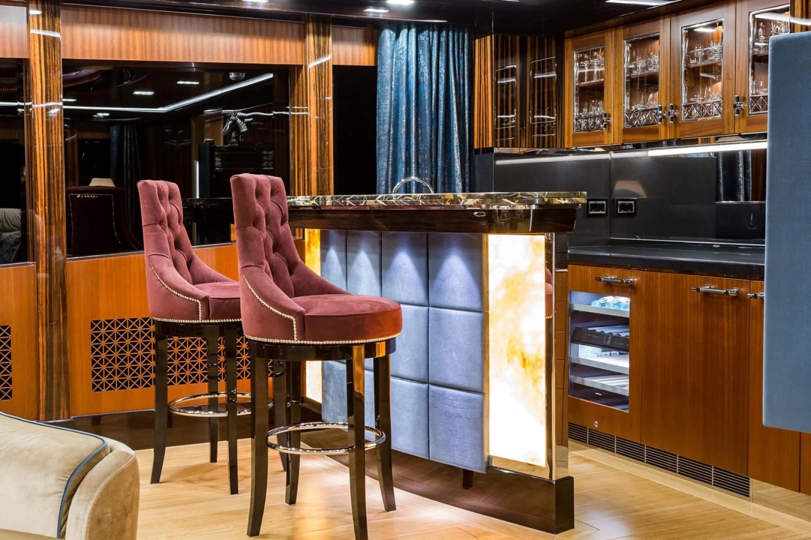 a couple of pink chairs in a kitchen aboard VIATORIS Yacht for Sale