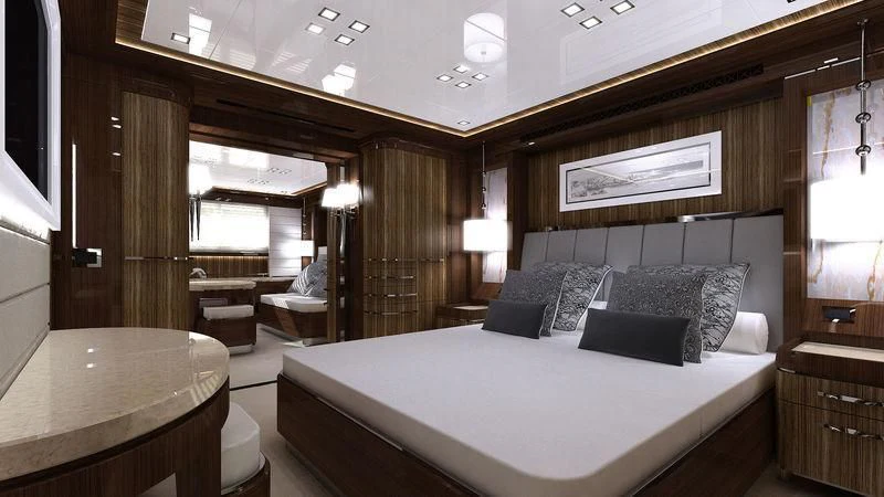 a large bedroom with a bed and a desk aboard VIATORIS Yacht for Sale