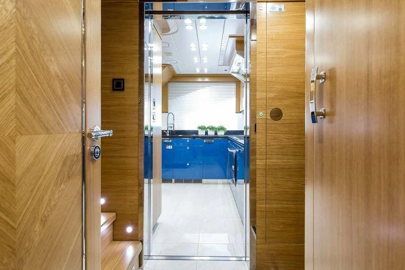 a room with a door and a mirror aboard VIATORIS Yacht for Sale