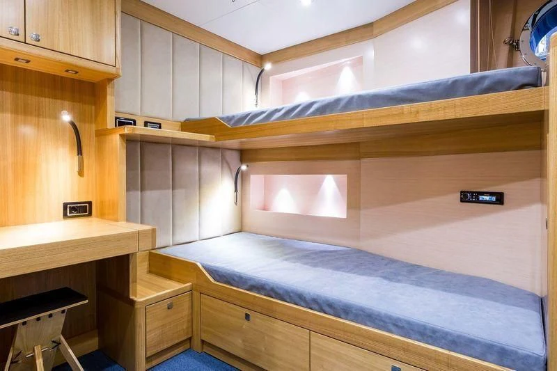 a kitchen with wooden cabinets aboard VIATORIS Yacht for Sale