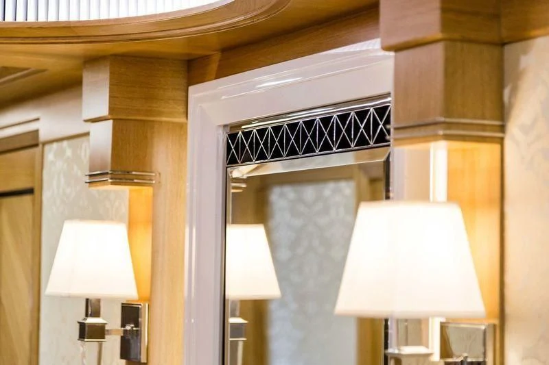 a room with a lamp and a window aboard VIATORIS Yacht for Sale