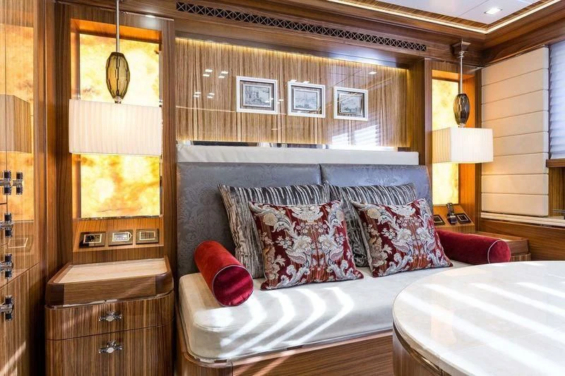 a room with a bed and a desk aboard VIATORIS Yacht for Sale