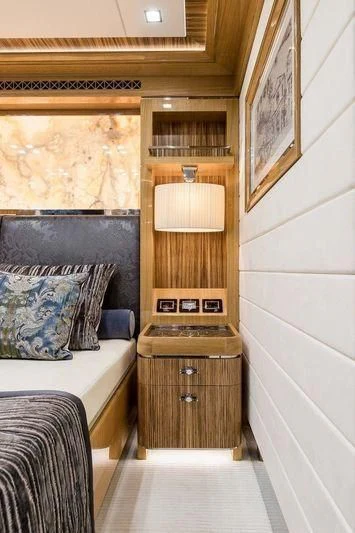 a room with a bed and a desk aboard VIATORIS Yacht for Sale