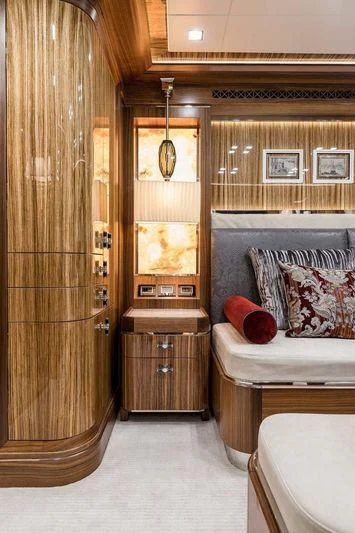 a room with a bed and a wood door aboard VIATORIS Yacht for Sale