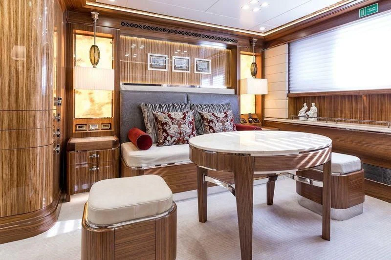 a room with a table and chairs aboard VIATORIS Yacht for Sale