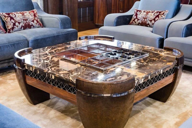 a glass coffee table in a living room aboard VIATORIS Yacht for Sale