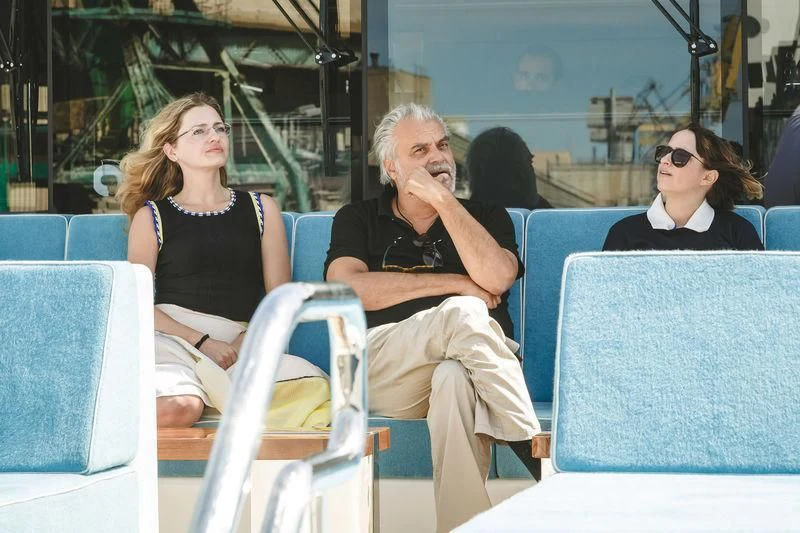 a group of people sitting in chairs aboard VIATORIS Yacht for Sale
