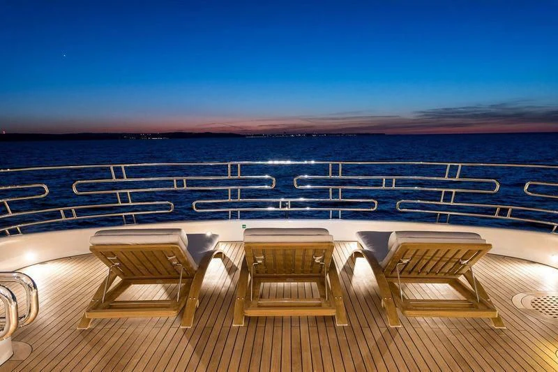 a deck with chairs and a pool aboard VIATORIS Yacht for Sale