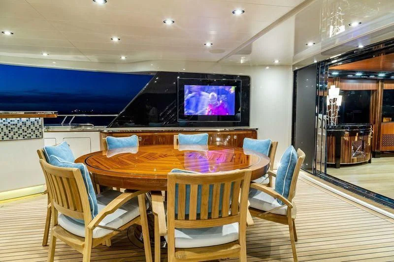 a table and chairs in a room aboard VIATORIS Yacht for Sale