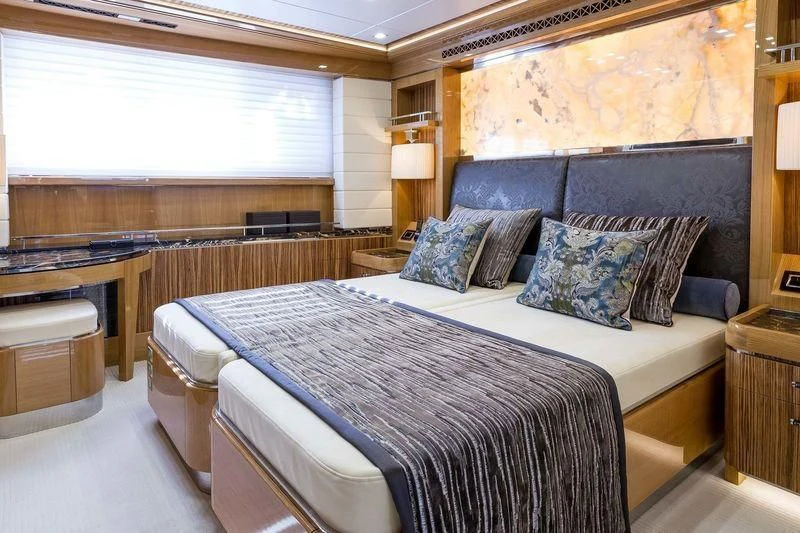 a large bed in a room aboard VIATORIS Yacht for Sale