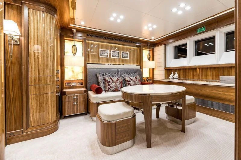 a room with a table and chairs aboard VIATORIS Yacht for Sale
