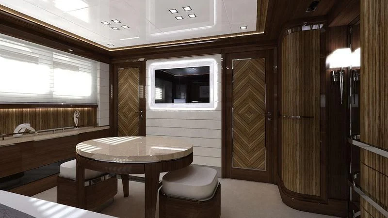a room with a table and chairs aboard VIATORIS Yacht for Sale
