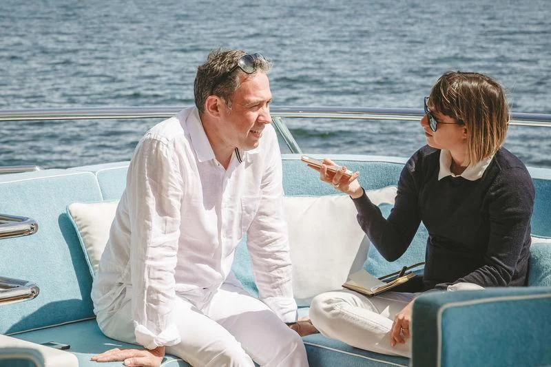 a man and a woman on a boat aboard VIATORIS Yacht for Sale
