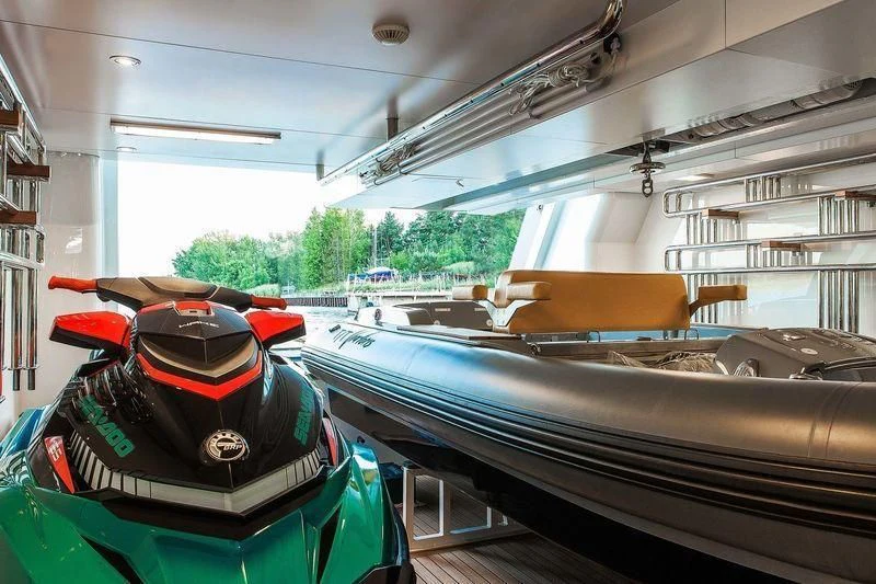 a group of cars in a garage aboard VIATORIS Yacht for Sale