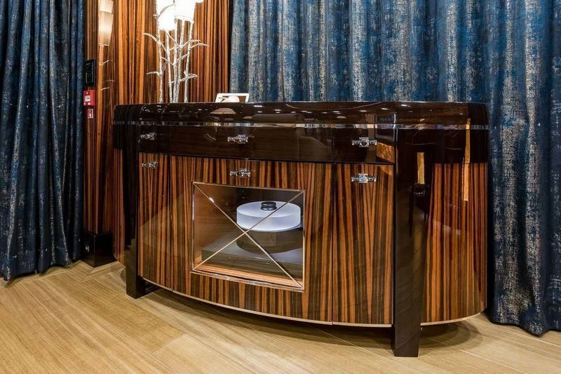 a wood cabinet in a room aboard VIATORIS Yacht for Sale