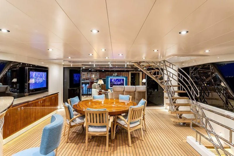 a room with a table and chairs aboard VIATORIS Yacht for Sale