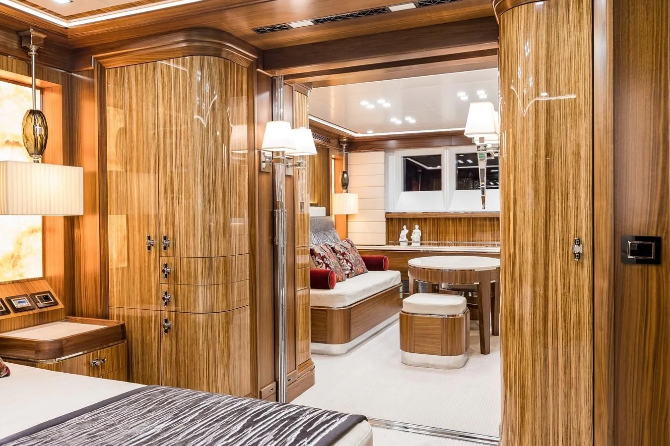 a room with a bed and a wood door aboard VIATORIS Yacht for Sale