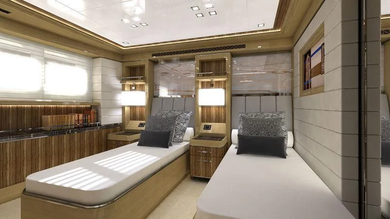 a room with a bed and a couch aboard VIATORIS Yacht for Sale