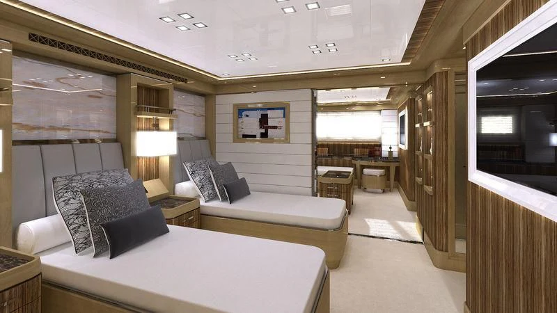 a room with a bed and a couch aboard VIATORIS Yacht for Sale