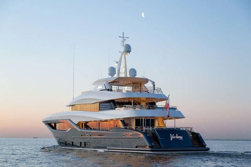 a large ship in the water aboard VIATORIS Yacht for Sale
