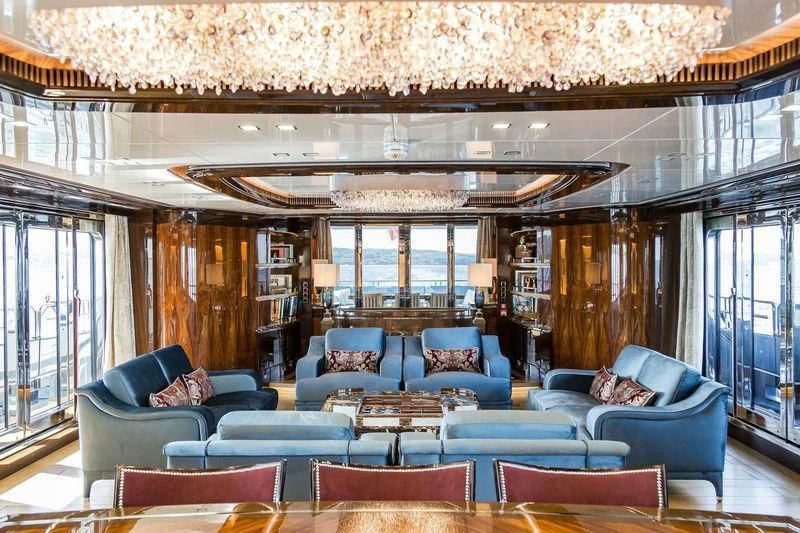 a living room with a large window aboard VIATORIS Yacht for Sale