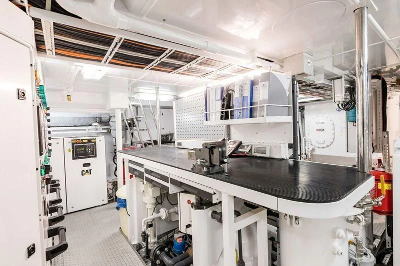 a large room with white cabinets aboard VIATORIS Yacht for Sale