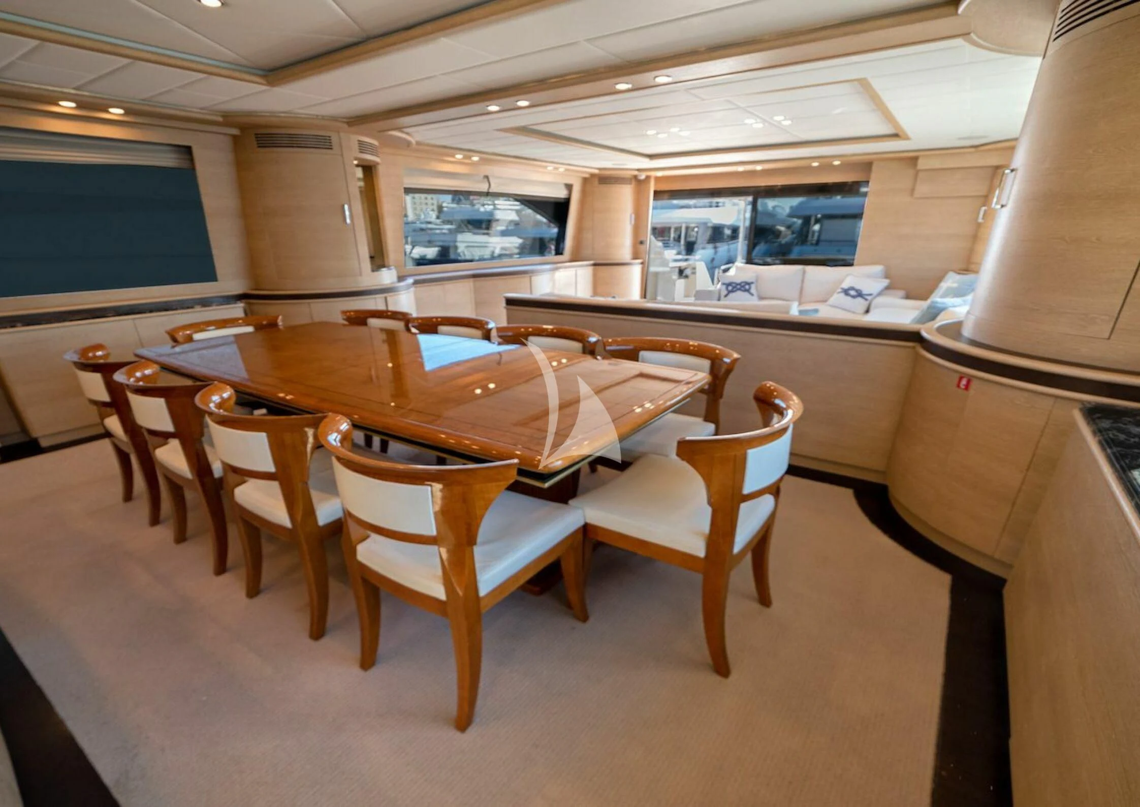 a table and chairs in a room aboard GRACE Yacht for Sale