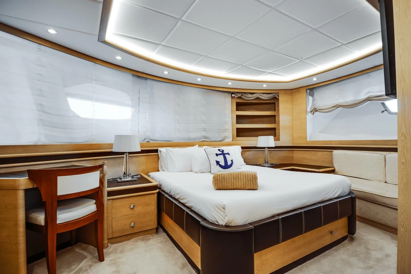 a room with a bed and a desk aboard GRACE Yacht for Sale