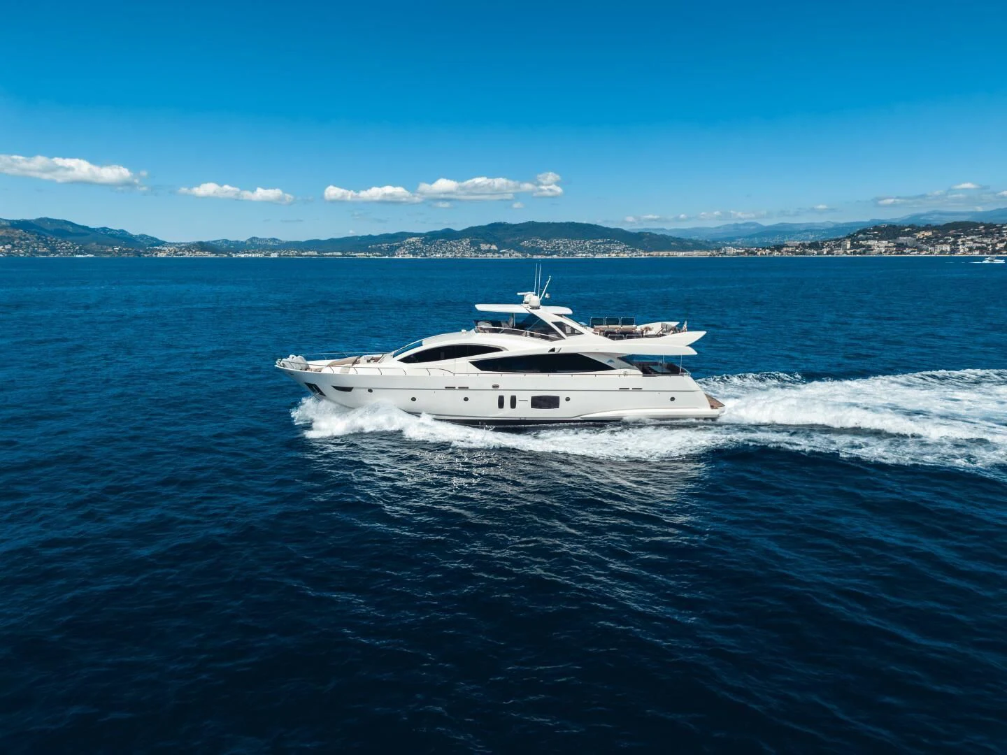 a white yacht on the water aboard GRACE Yacht for Sale