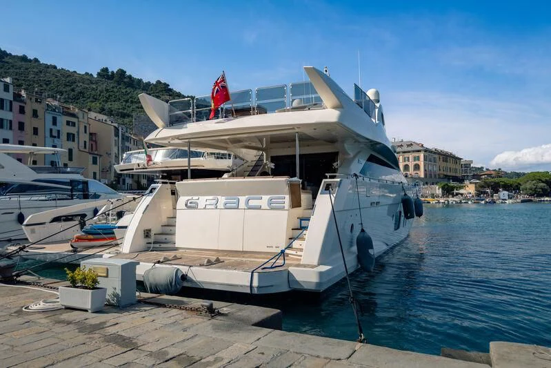 a boat docked at a pier aboard GRACE Yacht for Sale