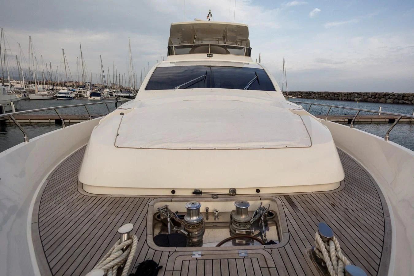 a white yacht on a deck aboard GRACE Yacht for Sale