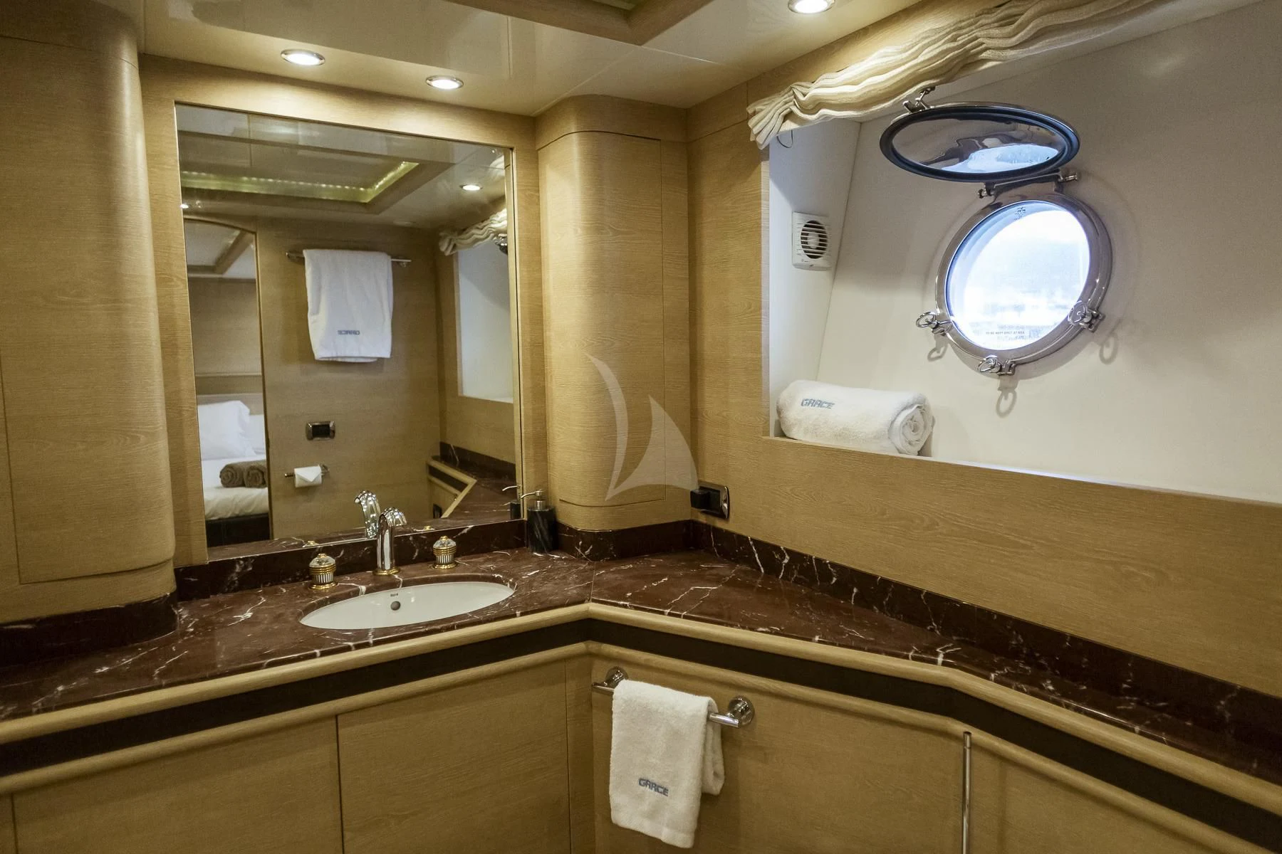a bathroom with a large mirror aboard GRACE Yacht for Sale