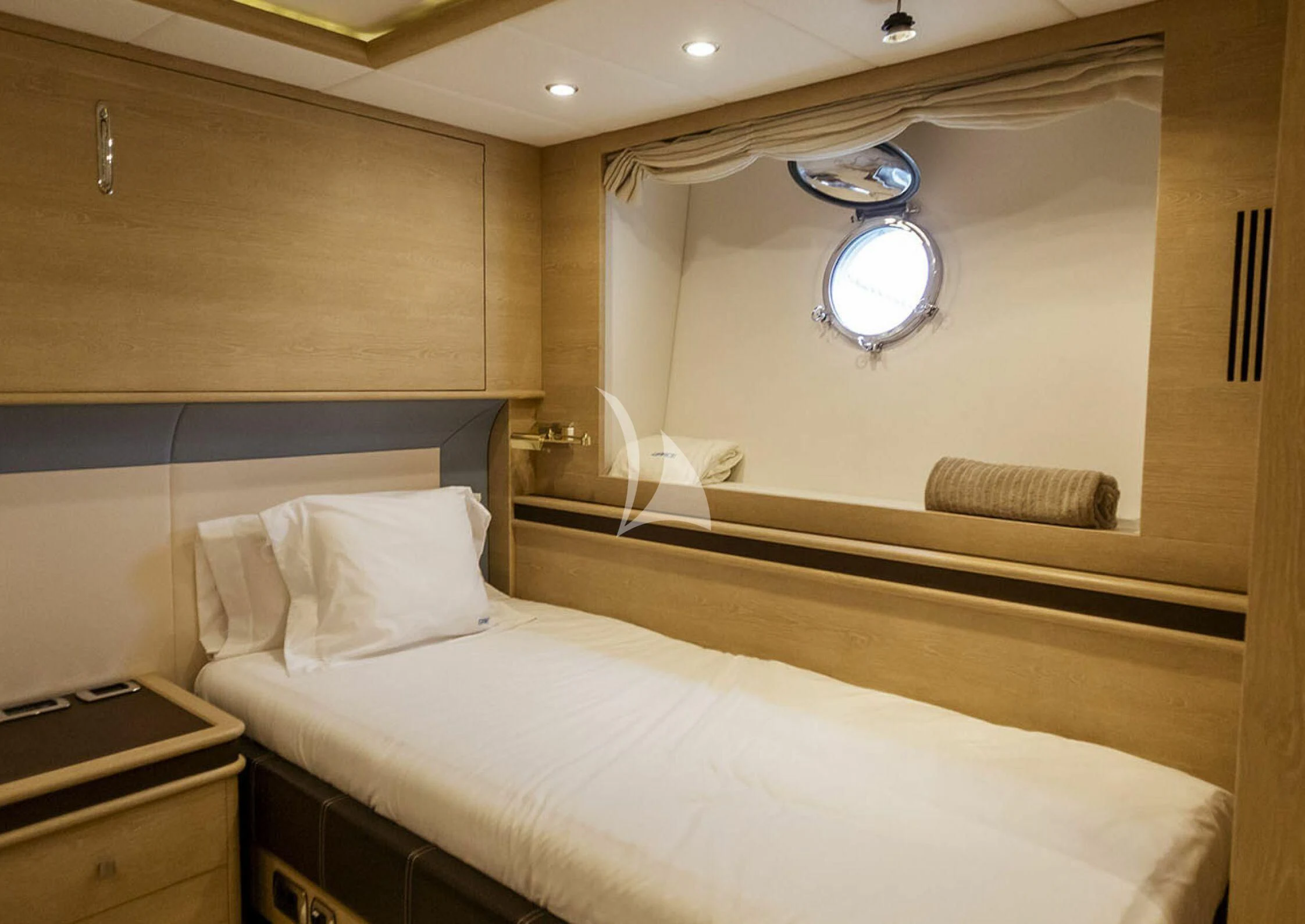 a room with a bed and a mirror aboard GRACE Yacht for Sale