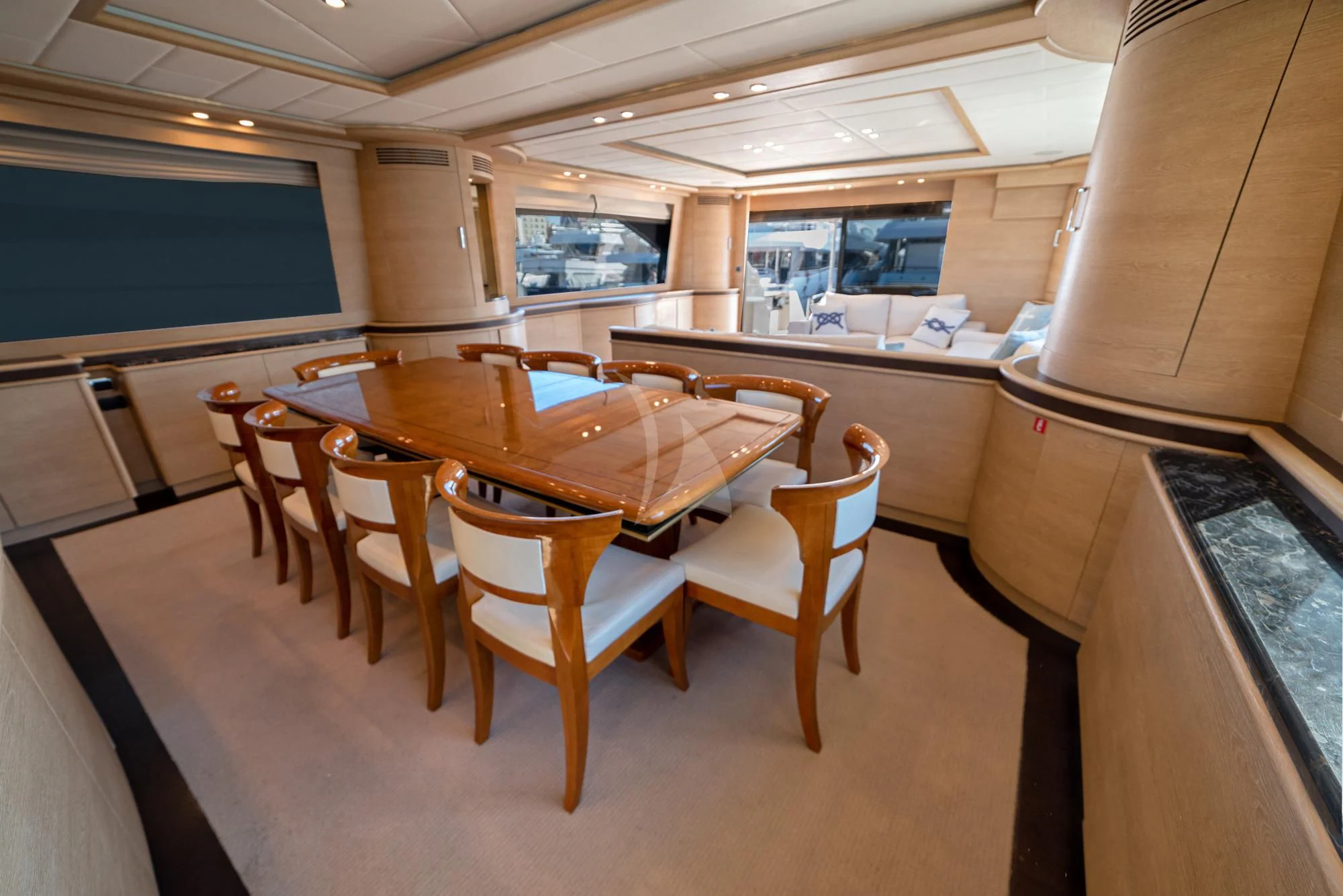 a table and chairs in a room aboard GRACE Yacht for Sale
