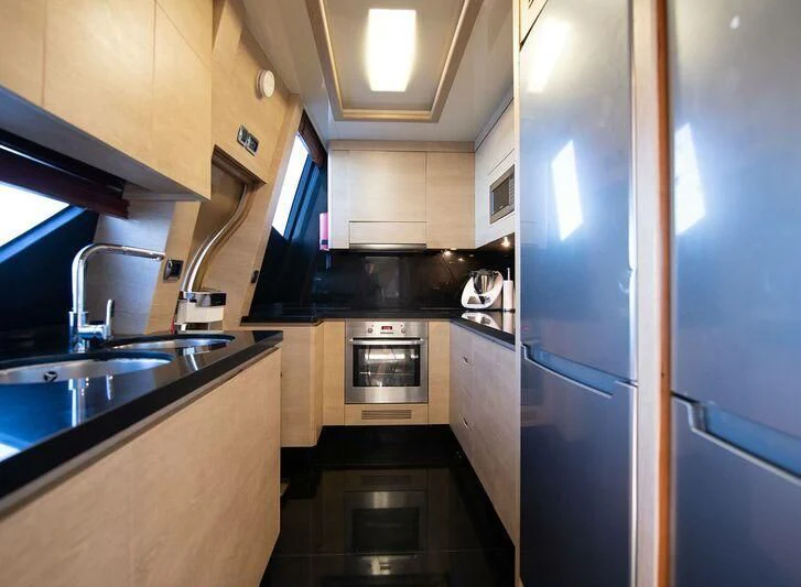 a kitchen with stainless steel appliances aboard GRACE Yacht for Sale