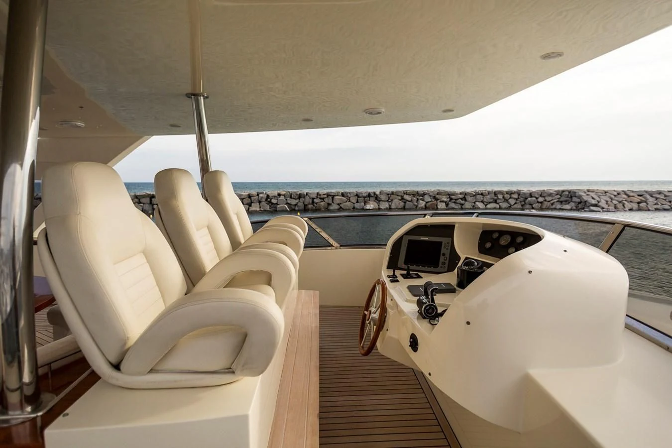 a white airplane with a black seat aboard GRACE Yacht for Sale