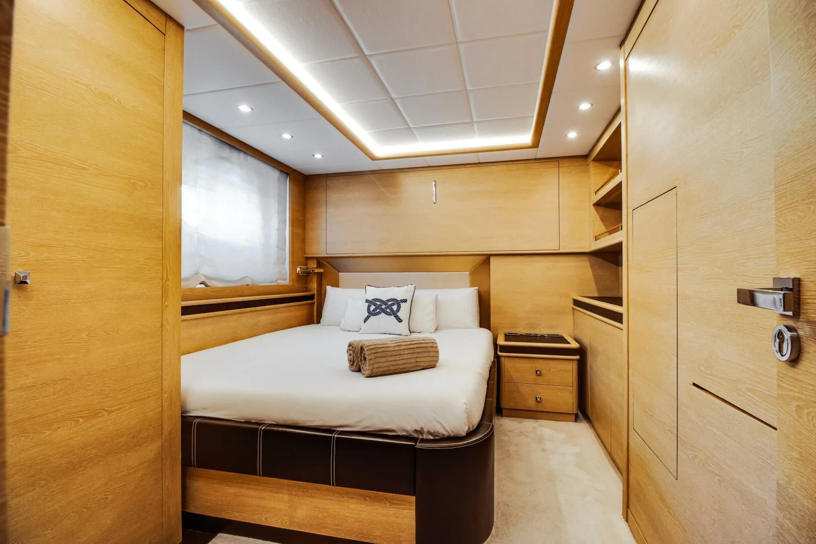 a room with a bed and a shelf aboard GRACE Yacht for Sale