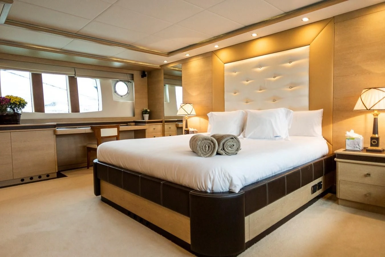 a large bed in a room aboard GRACE Yacht for Sale