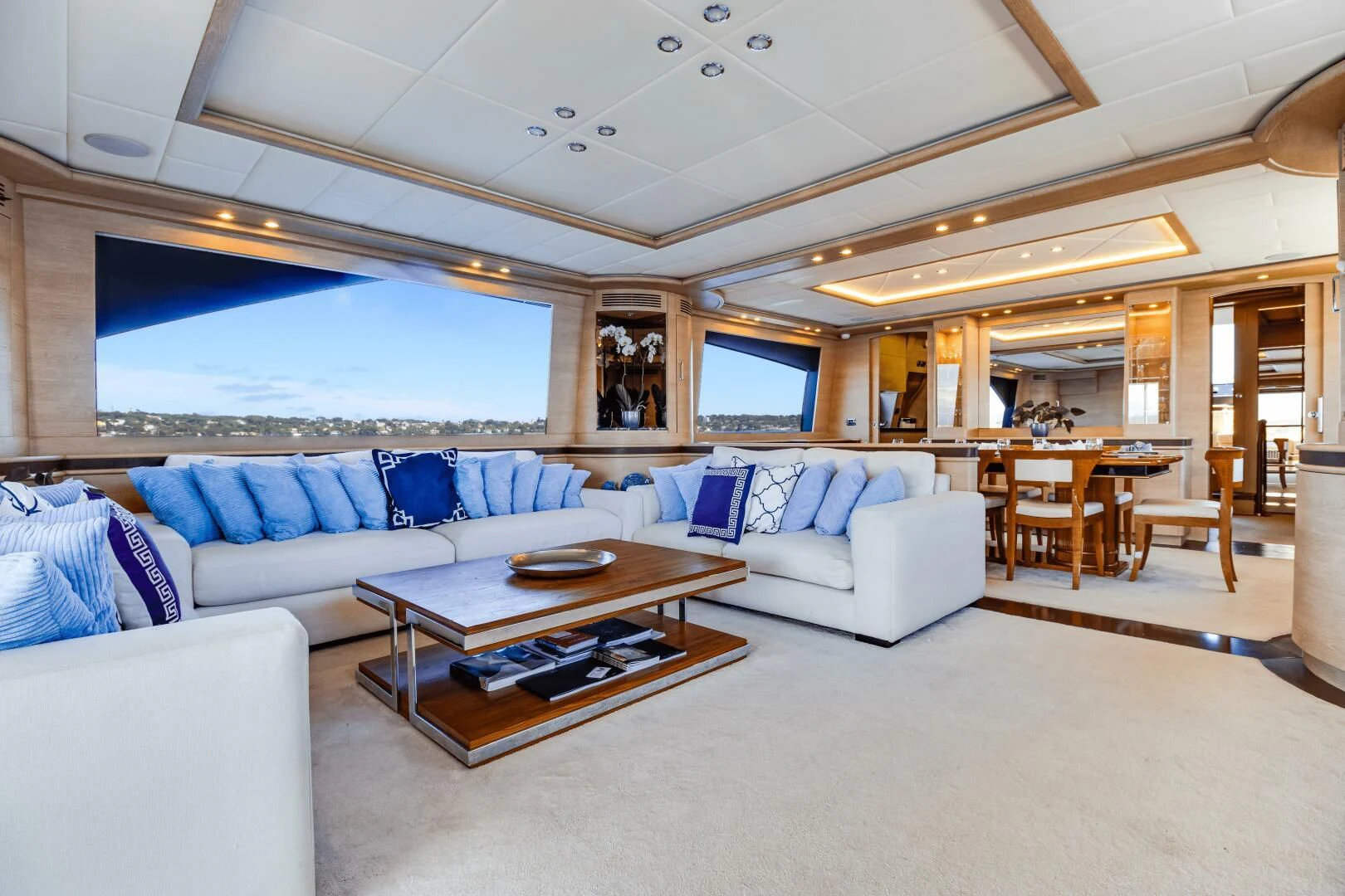 a living room with a couch and a table aboard GRACE Yacht for Sale