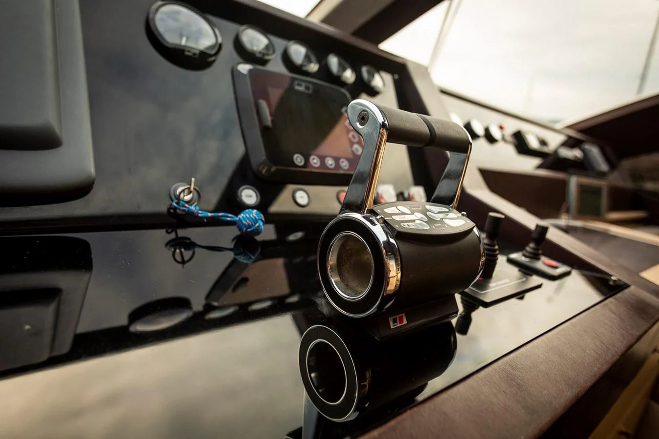a camera on a table aboard GRACE Yacht for Sale
