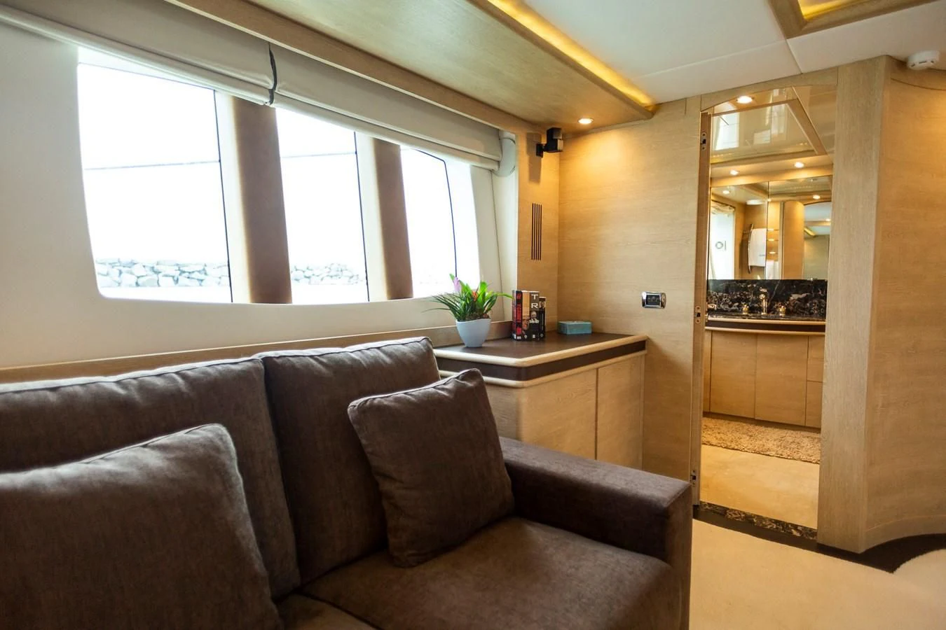 a living room with a couch and a table aboard GRACE Yacht for Sale