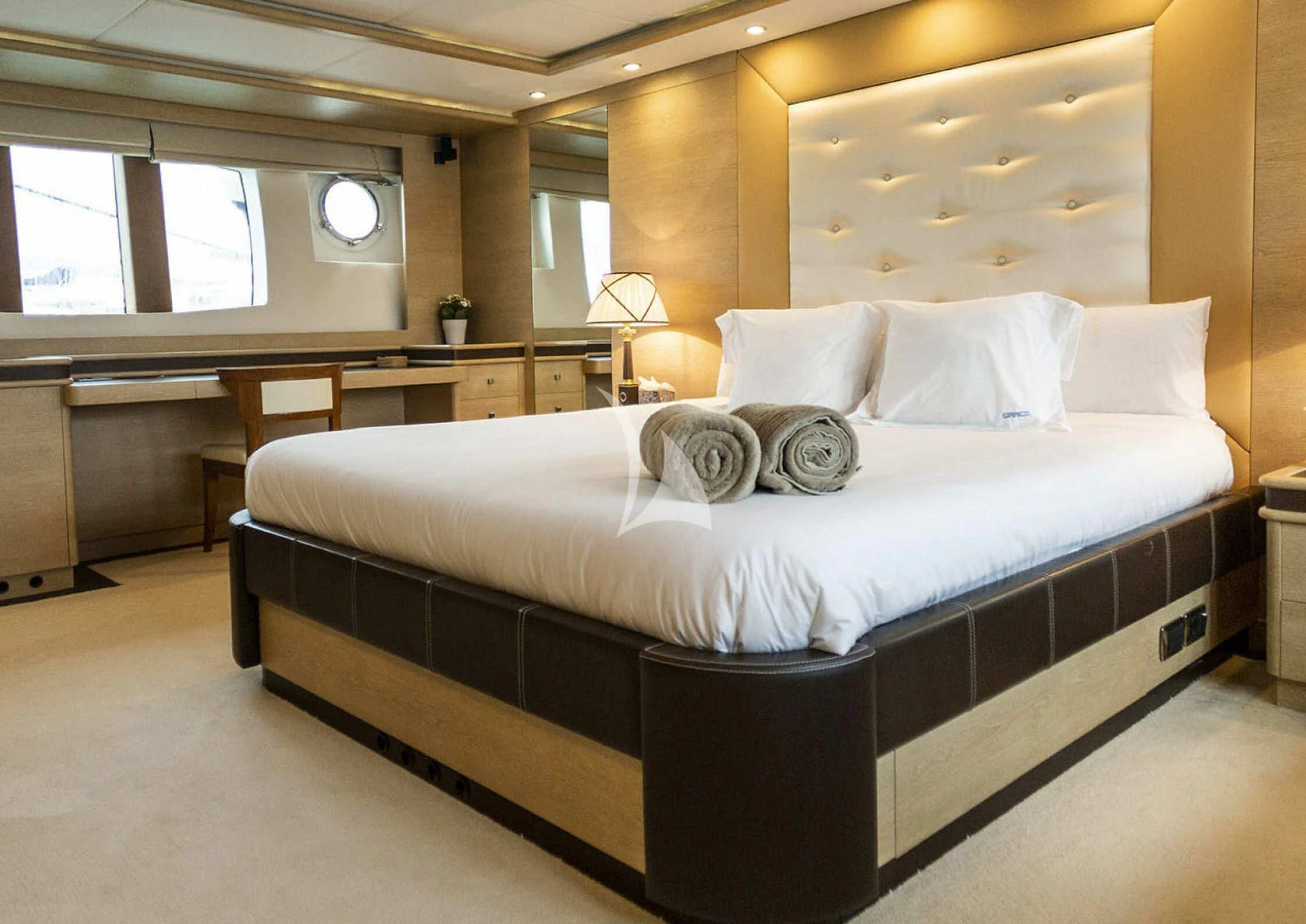 a large bed in a room aboard GRACE Yacht for Sale