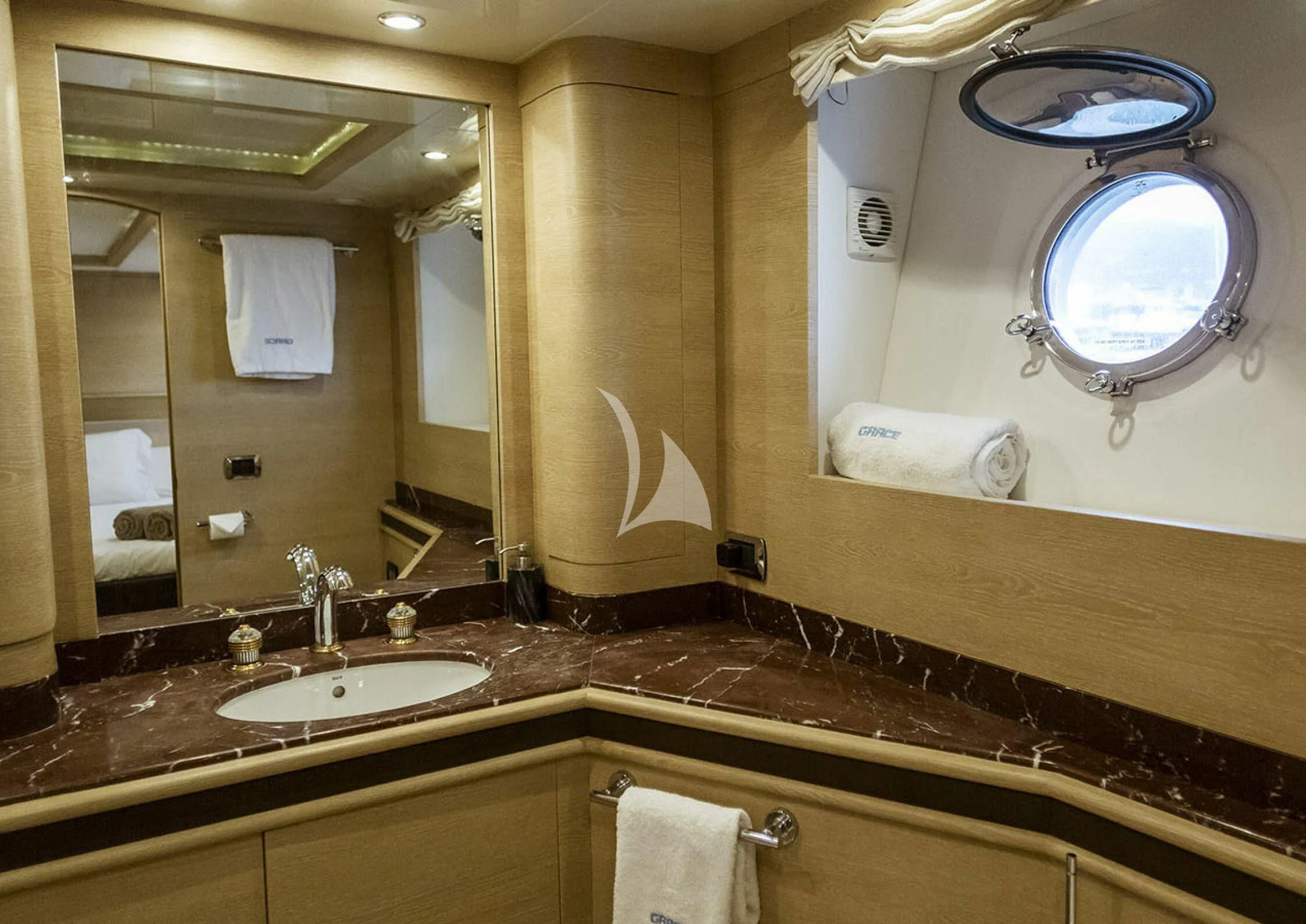 a bathroom with a large mirror aboard GRACE Yacht for Sale