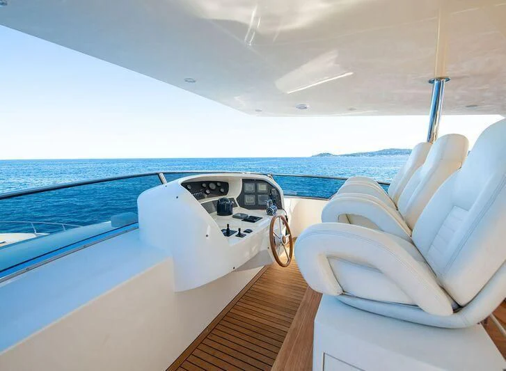 a boat with a white steering wheel aboard GRACE Yacht for Sale