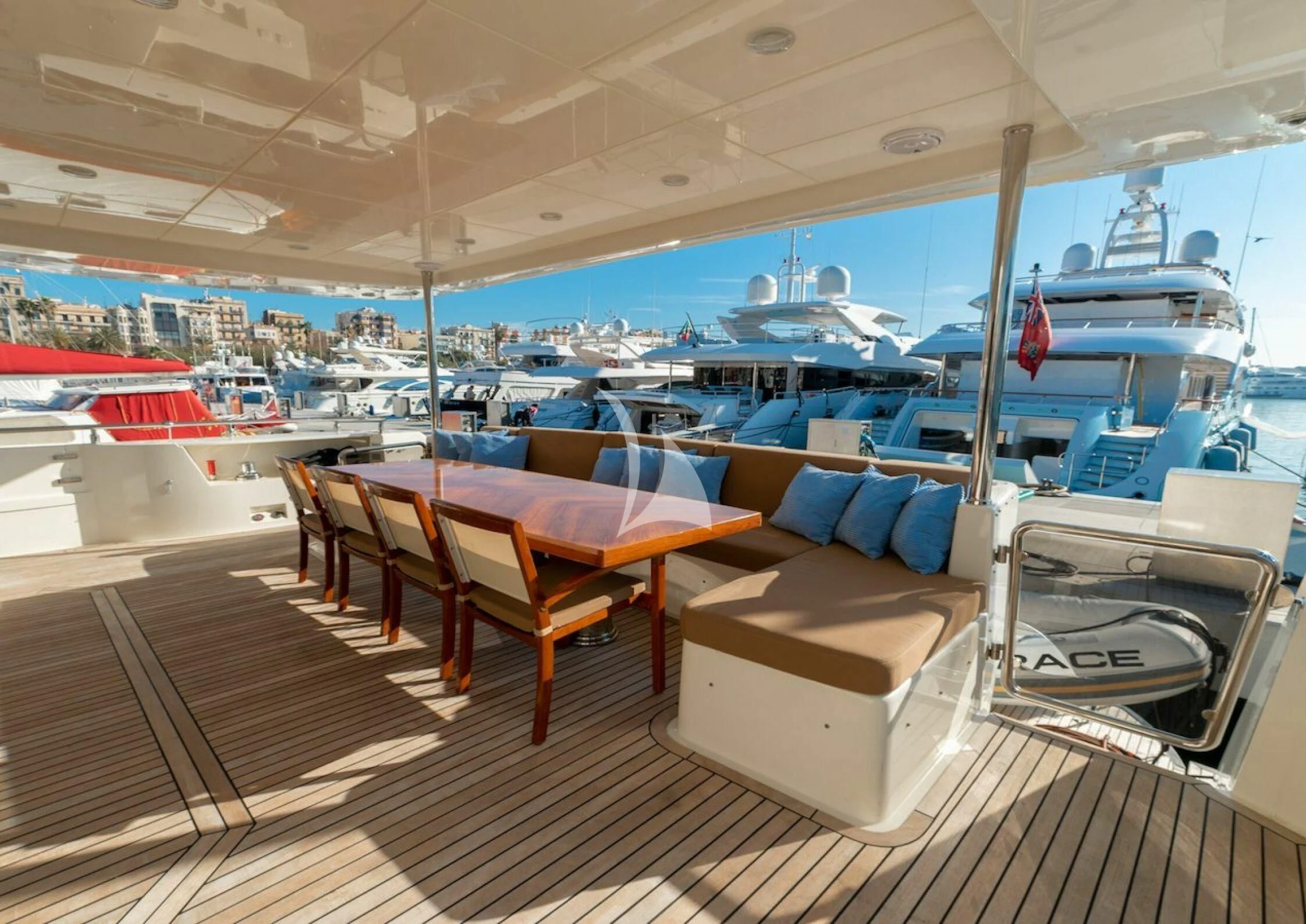 a boat with a deck and chairs aboard GRACE Yacht for Sale