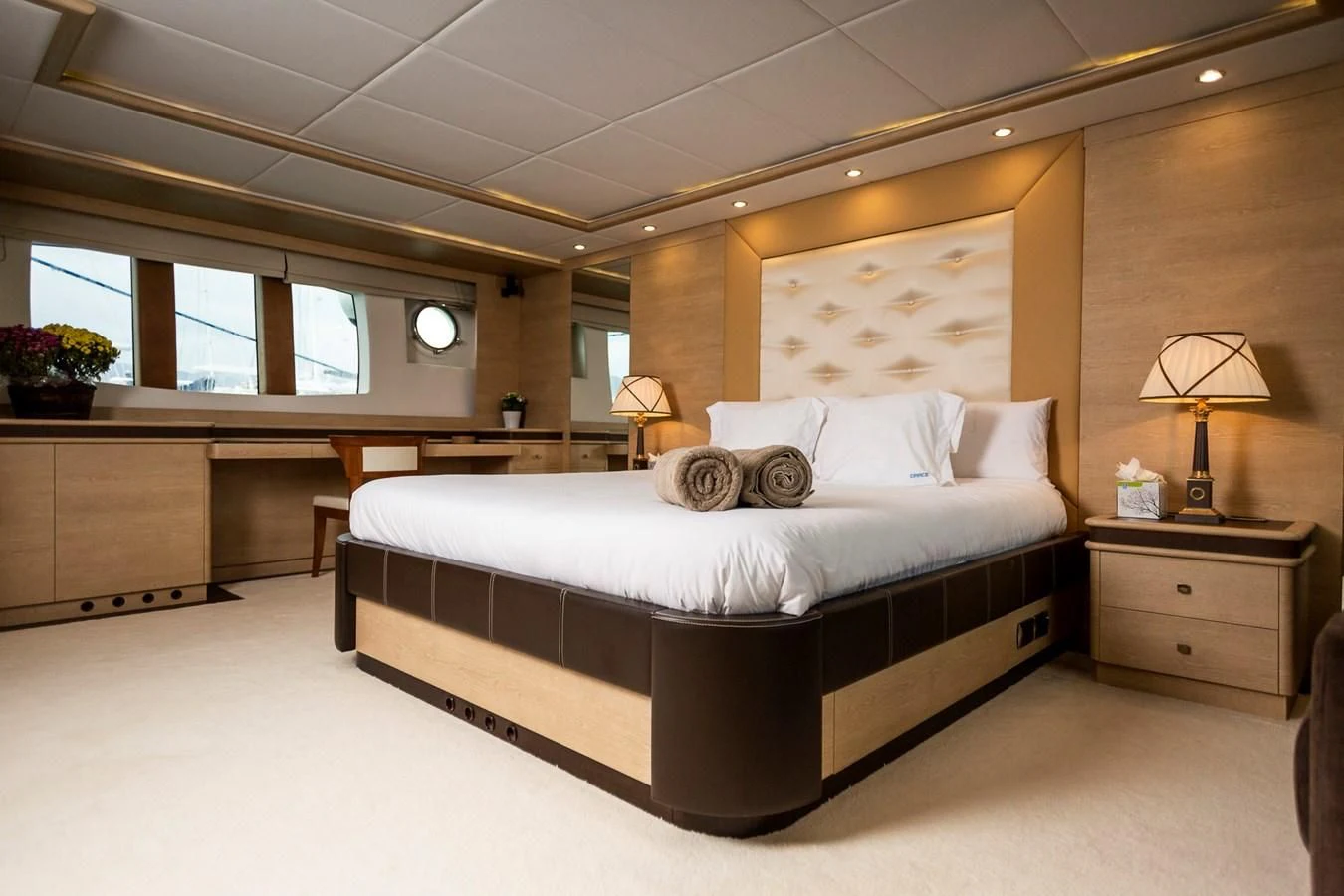 a large bed in a room aboard GRACE Yacht for Sale