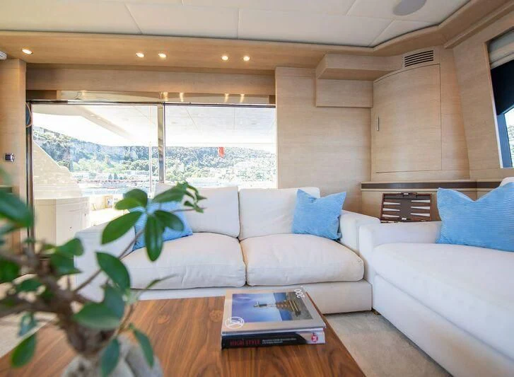 a living room with a couch and a table aboard GRACE Yacht for Sale