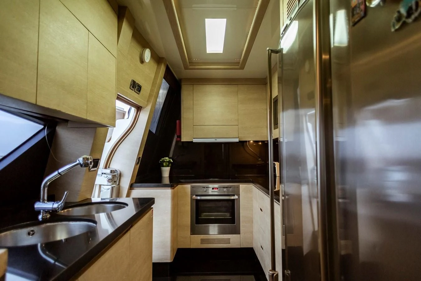 a kitchen with a stainless steel sink aboard GRACE Yacht for Sale