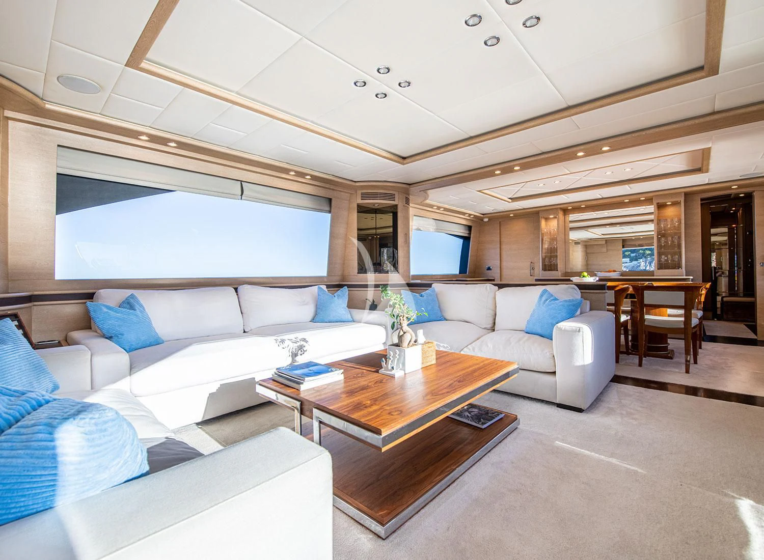 a living room with a couch and a coffee table aboard GRACE Yacht for Sale
