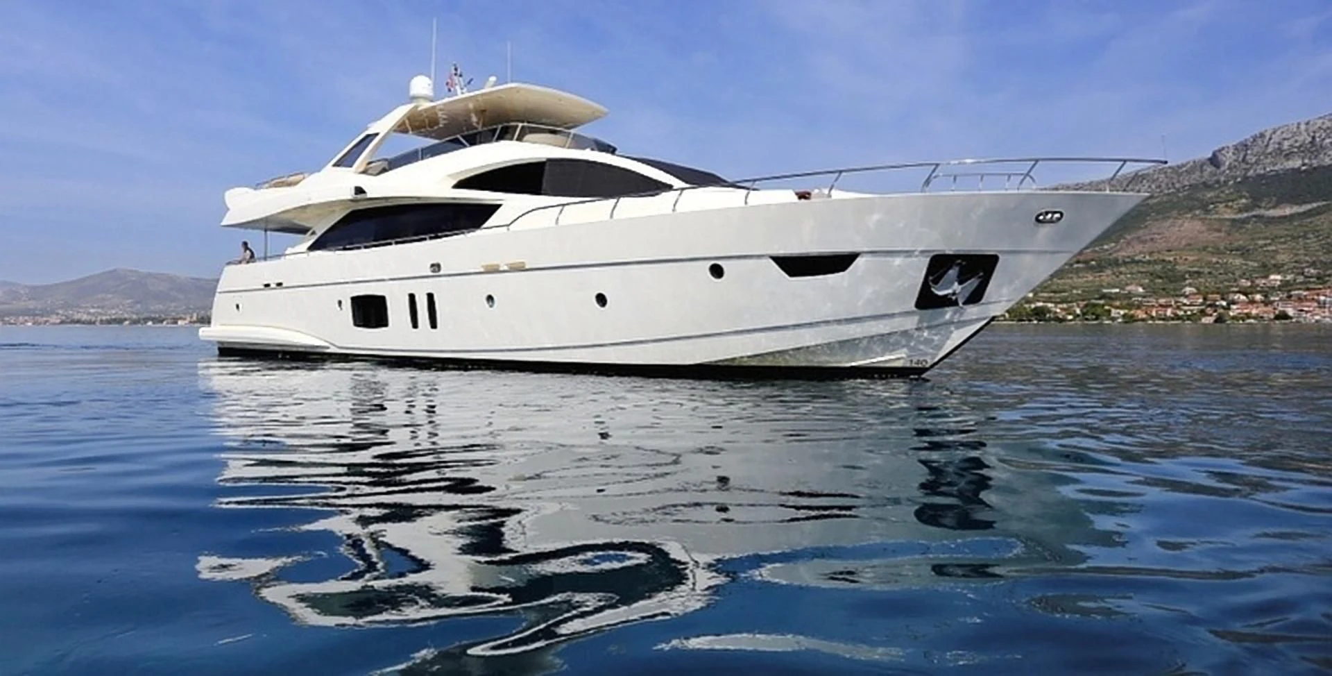 a white yacht on the water aboard GRACE Yacht for Sale